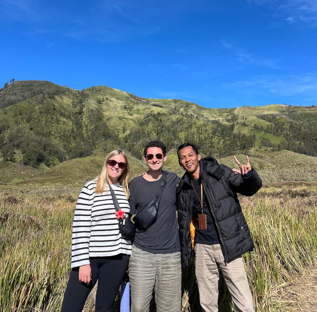 Scenic view of Kawah Ijen volcano at sunset with colorful sky and crater lake